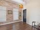 Charming theater room with a vintage movie theatre sign, brick wall, and two windows at 2010 E Palm Ave # 14303, Tampa, FL 33605