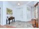 Bright foyer with tile flooring, decorative front door and adjacent stained glass windows at 2226 N Creek Ct, Sun City Center, FL 33573