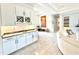 Stylish bar area features sleek countertops, ample cabinet space, and wine storage, perfect for entertaining guests at 31889 Tortuga Shore Loop, Wesley Chapel, FL 33545
