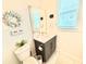 Charming bathroom featuring beach-themed decor, vanity, and a coastal-inspired ambiance at 31889 Tortuga Shore Loop, Wesley Chapel, FL 33545