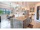 Open-concept kitchen featuring an island with a sink, stainless steel appliances, and adjacent breakfast nook at 31889 Tortuga Shore Loop, Wesley Chapel, FL 33545