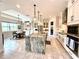Spacious kitchen featuring a large island, modern appliances, and an adjacent dining area for Gathering meals at 31889 Tortuga Shore Loop, Wesley Chapel, FL 33545