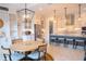 Bright kitchen with white cabinets, stainless steel appliances, and adjacent breakfast nook for casual dining at 31889 Tortuga Shore Loop, Wesley Chapel, FL 33545