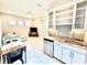 Open living space features a kitchenette, dining area, and seating area, creating a comfortable and inviting atmosphere at 31889 Tortuga Shore Loop, Wesley Chapel, FL 33545