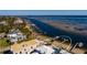 Stunning aerial view of waterfront property with private docks and lush landscaping at 3319 Bayshore Ne Blvd, St Petersburg, FL 33703