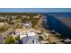 Beautiful aerial view of waterfront home with boat dock and stunning ocean views at 3319 Bayshore Ne Blvd, St Petersburg, FL 33703