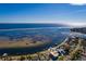 Panoramic aerial view of waterfront house and dock against a stunning waterfront backdrop on a bright day at 3319 Bayshore Ne Blvd, St Petersburg, FL 33703