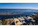 Waterfront home featuring a private beach, dock, and scenic water views at 3319 Bayshore Ne Blvd, St Petersburg, FL 33703
