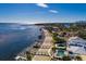 Waterfront home featuring a pool, dock, and stunning water views at 3319 Bayshore Ne Blvd, St Petersburg, FL 33703