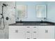 Contemporary bathroom featuring a double vanity with modern fixtures and an elegant marble-tiled shower at 3319 Bayshore Ne Blvd, St Petersburg, FL 33703