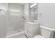 Bathroom featuring a tiled walk-in shower, granite countertop vanity, and modern fixtures at 3319 Bayshore Ne Blvd, St Petersburg, FL 33703
