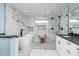A modern bathroom with a freestanding tub, walk-in shower, and double vanity, offering a spa-like experience at 3319 Bayshore Ne Blvd, St Petersburg, FL 33703
