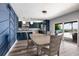 Dining area showcasing a kitchen, with sliders that lead to a deck overlooking the water at 3319 Bayshore Ne Blvd, St Petersburg, FL 33703