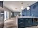 View of kitchen island with stainless steel appliances, open concept design, and dining area access at 3319 Bayshore Ne Blvd, St Petersburg, FL 33703