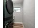 Modern laundry room featuring gray walls, wood floors, and front load washer and dryer at 3319 Bayshore Ne Blvd, St Petersburg, FL 33703