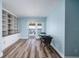 Spacious living room with hardwood style floors, built in shelving and patio access at 3319 Bayshore Ne Blvd, St Petersburg, FL 33703