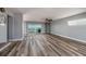 Spacious living room with luxury vinyl flooring, ceiling fan, and view of the beautiful ocean at 3319 Bayshore Ne Blvd, St Petersburg, FL 33703