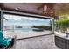 Enclosed patio featuring comfortable seating and scenic views of the pool, private dock, and ocean at 3319 Bayshore Ne Blvd, St Petersburg, FL 33703