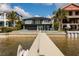 View from the dock to a waterfront property with neighboring homes nearby at 3319 Bayshore Ne Blvd, St Petersburg, FL 33703