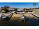 Waterfront view of luxurious homes featuring docks and beautiful landscaping at 3319 Bayshore Ne Blvd, St Petersburg, FL 33703