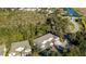 Aerial view of the neighborhood highlighting mature landscaping and nearby community amenities at 3665 Country Pointe Pl, Palm Harbor, FL 34684