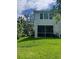Well-manicured backyard and screened-in porch, great for outdoor relaxation at 3665 Country Pointe Pl, Palm Harbor, FL 34684