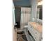 Well-lit bathroom with marble counter tops, new fixtures and decor at 3665 Country Pointe Pl, Palm Harbor, FL 34684