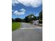 Entryway to community with sign and landscaping at 3665 Country Pointe Pl, Palm Harbor, FL 34684