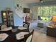 Comfortable living room offering backyard access and a staircase at 3665 Country Pointe Pl, Palm Harbor, FL 34684