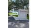 Community mailboxes next to pond with a fountain; accessible path at 3665 Country Pointe Pl, Palm Harbor, FL 34684