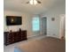 Main bedroom includes a wall mounted flat screen TV at 3665 Country Pointe Pl, Palm Harbor, FL 34684