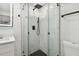 Bathroom featuring new tile shower and modern finishes at 4220 E Regnas Ave, Tampa, FL 33617