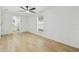 Spacious bedroom with hardwood floors and natural light at 4220 E Regnas Ave, Tampa, FL 33617