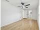 Primary bedroom with hardwood floors and an adjoining bathroom at 4220 E Regnas Ave, Tampa, FL 33617