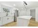 This open kitchen has a central island and stainless steel refrigerator at 4220 E Regnas Ave, Tampa, FL 33617