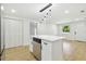 Eat-in kitchen island with a stainless steel dishwasher at 4220 E Regnas Ave, Tampa, FL 33617