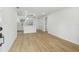 Spacious living area with modern kitchen, hardwood floors, and recessed lighting at 4220 E Regnas Ave, Tampa, FL 33617