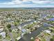 Spacious waterfront homes lining canals offer boat docks and pools under a partly cloudy blue sky at 4503 Jacona Dr, Hernando Beach, FL 34607