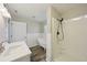 Bright bathroom featuring a standalone tub, walk-in shower, and a modern vanity sink at 4503 Jacona Dr, Hernando Beach, FL 34607