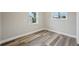 Neutral colored bedroom with hardwood flooring and white trim at 4503 Jacona Dr, Hernando Beach, FL 34607