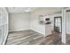 Open floor plan: dining area, kitchen with a breakfast bar, and stainless steel appliances at 4503 Jacona Dr, Hernando Beach, FL 34607