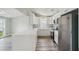 Elegant kitchen features white cabinetry, stainless steel appliances, and sleek quartz countertops at 4503 Jacona Dr, Hernando Beach, FL 34607