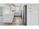Bright kitchen with white cabinets, stainless steel appliances, and quartz countertops at 4503 Jacona Dr, Hernando Beach, FL 34607