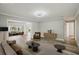 Virtually staged living room with contemporary furniture, hardwood flooring, and ample space at 4503 Jacona Dr, Hernando Beach, FL 34607
