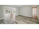 Spacious living room showcasing sleek hardwood floors and ample natural light at 4503 Jacona Dr, Hernando Beach, FL 34607