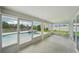 Enclosed pool area featuring a spacious patio and sliding glass doors at 4503 Jacona Dr, Hernando Beach, FL 34607