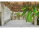 View from under the tiki hut facing the water and a docked boat at 4503 Jacona Dr, Hernando Beach, FL 34607