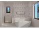 Modern bathroom showcasing soaking tub, shower with geometric tiles and a window view at 4535 26Th S Ave, St Petersburg, FL 33711