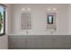 Bathroom featuring double vanity with marble countertops and lighted mirrors at 4535 26Th S Ave, St Petersburg, FL 33711