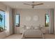 Serene bedroom with a king-sized bed, soft lighting, and serene views from the large window at 4535 26Th S Ave, St Petersburg, FL 33711